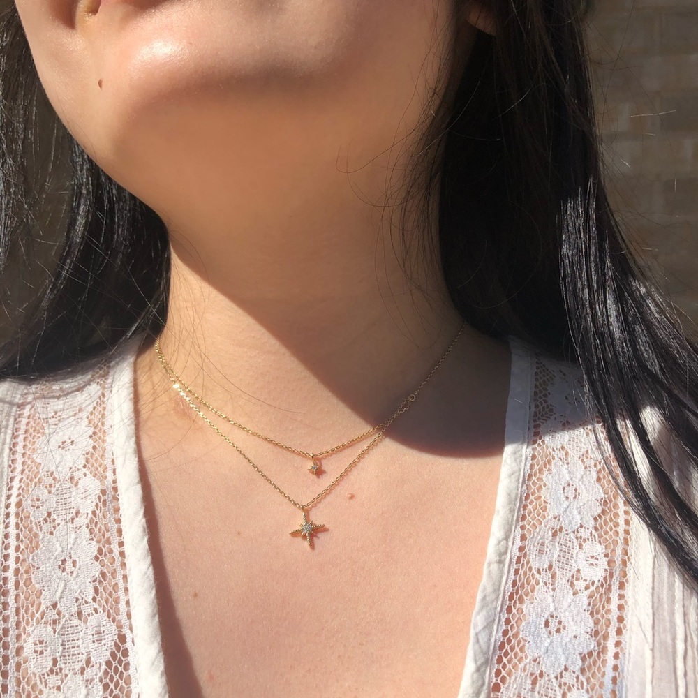 Gold tone layering necklace with star